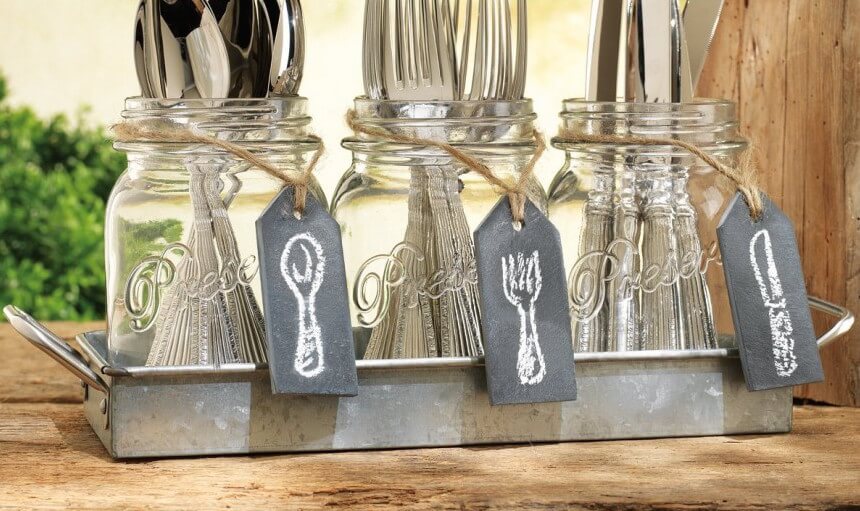 If you're looking for a neat way to store your silverware, a small tray with mason jars will keep your utensils organized and within easy reach. If you're looking for a neat way to store your silverware, a small tray with mason jars will keep your utensils organized and within easy reach.