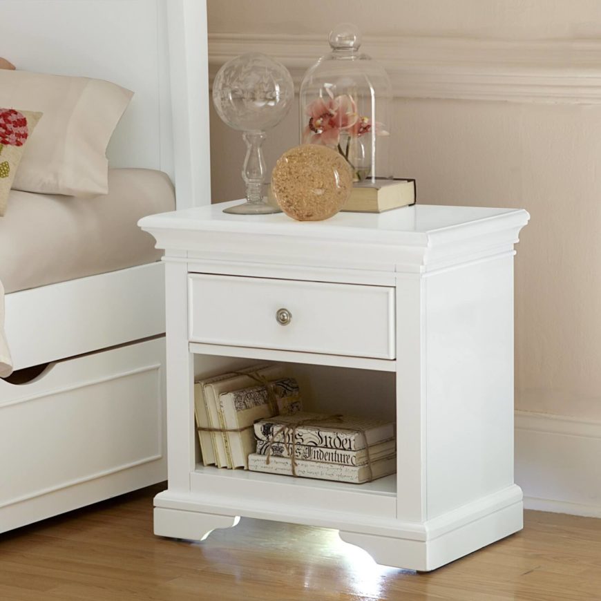 A shelf on the bottom is perfect for books, and the drawer above for everything else. A shelf on the bottom is perfect for books, and the drawer above for everything else.