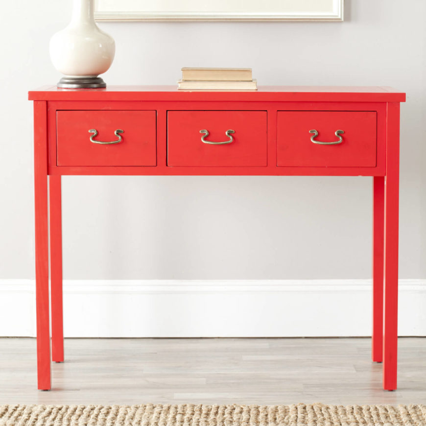 A console table is as at home in the foyer as it is in the living room, featuring three pull out drawers with brass handles and a bright red facade. This table is taller and longer, suitable for a long hallway. A console table is as at home in the foyer as it is in the living room, featuring three pull out drawers with brass handles and a bright red facade. This table is taller and longer, suitable for a long hallway.