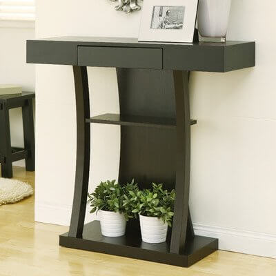 The curved legs of this table create a simple visual effect that makes the top feel as though it should be the same size as the bottom shelf. The curved legs of this table create a simple visual effect that makes the top feel as though it should be the same size as the bottom shelf.