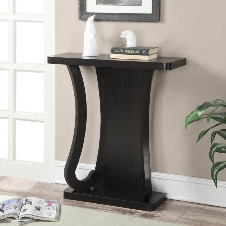 This sleek, modern table doesn't have any shelves, but it does make a nice spot to set your keys or purse when you walk in the door. It also works beautifully as a simple accent piece. This sleek, modern table doesn't have any shelves, but it does make a nice spot to set your keys or purse when you walk in the door. It also works beautifully as a simple accent piece.