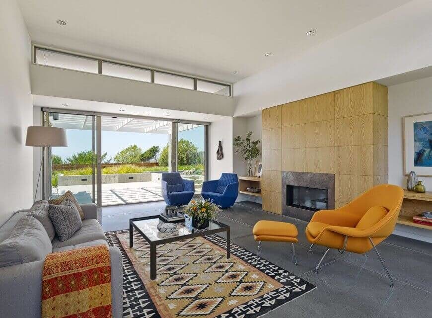 Seamless sliding doors in addition to a set of windows at the top of the ceiling ensure that this living room gets plenty of light. Seamless sliding doors in addition to a set of windows at the top of the ceiling ensure that this living room gets plenty of light.