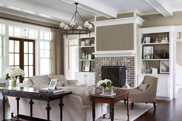 While taupe is still a cooler color, it brings out the warmth in the brick fireplace and in the wood floor, warming the room. While taupe is still a cooler color, it brings out the warmth in the brick fireplace and in the wood floor, warming the room.