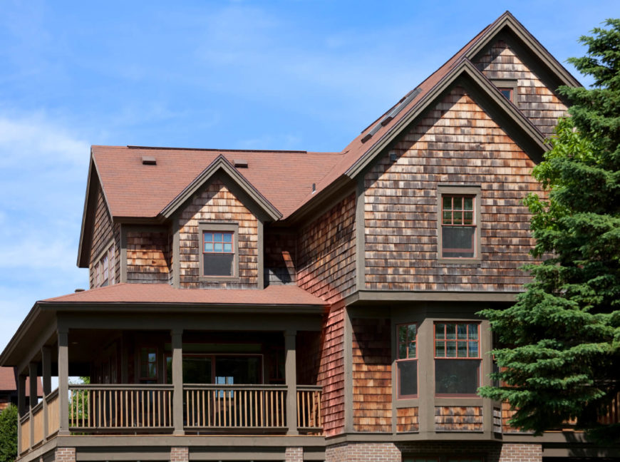 Shingles and shakes are similar in style and creation. Shakes are machine- or hand-sawn from blocks of wood to create thicker and less uniform, but more durable, covering for a house. Shingles are thinner and more uniform and are able to be cut into various shapes for more interest. Shingles and shakes are similar in style and creation. Shakes are machine- or hand-sawn from blocks of wood to create thicker and less uniform, but more durable, covering for a house. Shingles are thinner and more uniform and are able to be cut into various shapes for more interest.