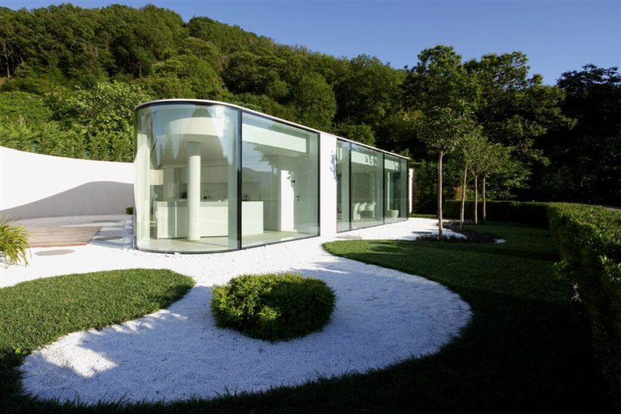 Using glass as an exterior material isn't for everyone, but it can't be denied that it creates a unique style and provides plenty of natural light to the interior. On the down side, besides a lack of privacy, glass would need to be cleaned regularly, but shouldn't require much more maintenance than that. Using glass as an exterior material isn't for everyone, but it can't be denied that it creates a unique style and provides plenty of natural light to the interior. On the down side, besides a lack of privacy, glass would need to be cleaned regularly, but shouldn't require much more maintenance than that.