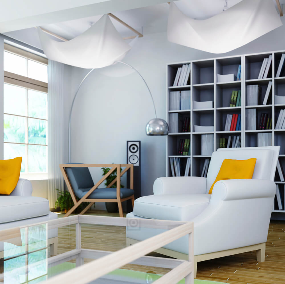 A modern home library with stylish bookshelves and cozy seats set on the home's hardwood flooring.