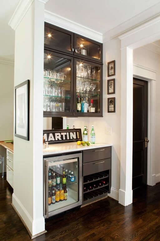 This home features a small bar counter with charming cabinetry.