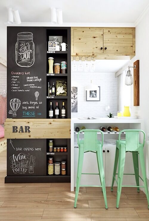 This home features a small bar with stylish shelving and counter set on the hardwood flooring.