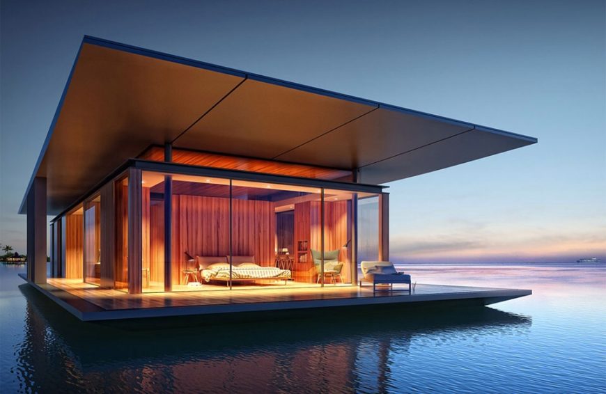 A floating home permanently moored off the coast of an island. The modern style home is wrapped in glass so that the view of the water and horizon is constant. The interior also features blackout curtains for when more privacy is desired. A floating home permanently moored off the coast of an island. The modern style home is wrapped in glass so that the view of the water and horizon is constant. The interior also features blackout curtains for when more privacy is desired.