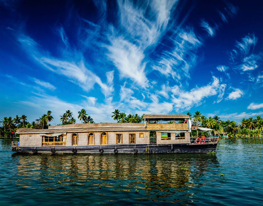 A longer houseboat in Kerala. Note the arched window and door frames, along with an upper tier for a better vantage point. A longer houseboat in Kerala. Note the arched window and door frames, along with an upper tier for a better vantage point.