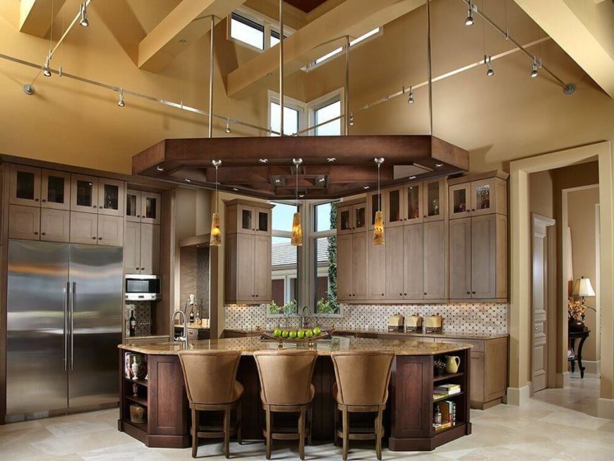 Shades of tan and brown do a great job of breaking up this space while remaining in the same color family to keep the neutral tone the design was going for. Alternating colors like the pale floor, tan cabinets, pale backsplash, and so on keep any one hue from dominating the room. The dark brown is kept to the floor and ceiling, effectively framing the space with its dark lines. Shades of tan and brown do a great job of breaking up this space while remaining in the same color family to keep the neutral tone the design was going for. Alternating colors like the pale floor, tan cabinets, pale backsplash, and so on keep any one hue from dominating the room. The dark brown is kept to the floor and ceiling, effectively framing the space with its dark lines.