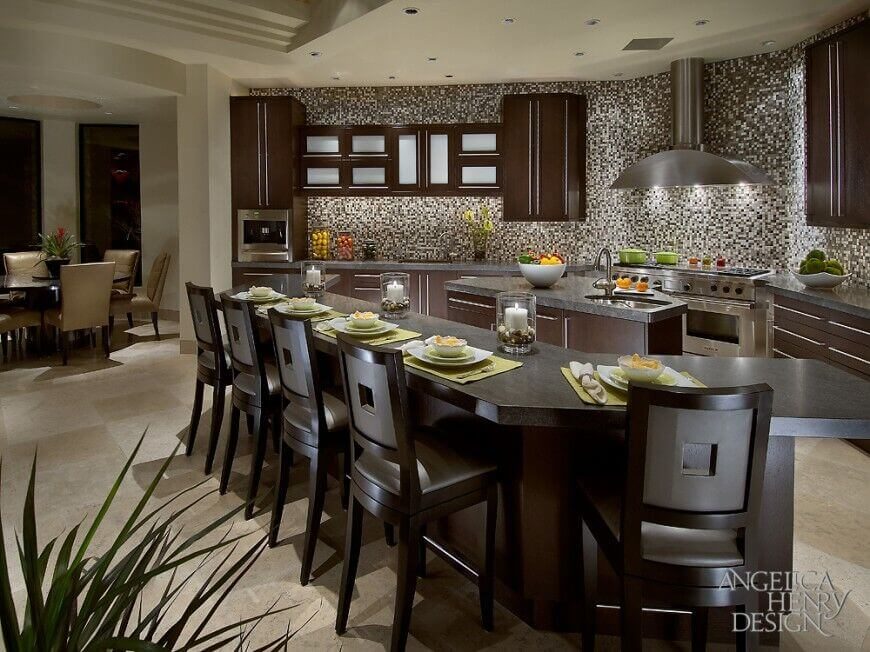 A light canvas is created for this kitchen via the floor and ceiling. That light color is carried into the tiled backsplash to bring together the light and dark colors used in the palette of the room; giving way to the dark chocolate cabinets and slate grey countertops. The decor is accented with bright spring green, cheery orange, and vibrant yellow - adding colorful interest to the space. A light canvas is created for this kitchen via the floor and ceiling. That light color is carried into the tiled backsplash to bring together the light and dark colors used in the palette of the room; giving way to the dark chocolate cabinets and slate grey countertops. The decor is accented with bright spring green, cheery orange, and vibrant yellow - adding colorful interest to the space.