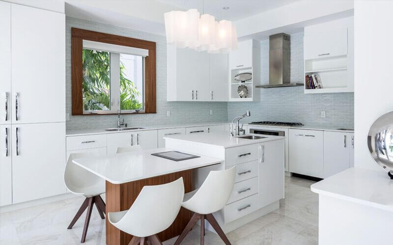 The pale palette of this room is broken up by the introduction of natural wood accents. The pale blue tiled walls add a difference in the shade of the room but keep to the washed out color scheme, helping to keep the space light and bright. The pale palette of this room is broken up by the introduction of natural wood accents. The pale blue tiled walls add a difference in the shade of the room but keep to the washed out color scheme, helping to keep the space light and bright.