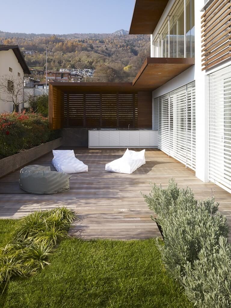 Outdoor kitchen on a deck featuring a white counter.