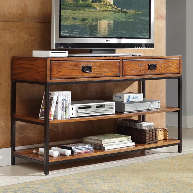 This console style piece features our first instance of metal, pairing perfectly with the rich wood tones of the stand. This design sees a thick tabletop with large drawers framed with a pair of lower shelves by a thin black metal structure, plus matching drawer handles for an extra dose of contrast. This console style piece features our first instance of metal, pairing perfectly with the rich wood tones of the stand. This design sees a thick tabletop with large drawers framed with a pair of lower shelves by a thin black metal structure, plus matching drawer handles for an extra dose of contrast.