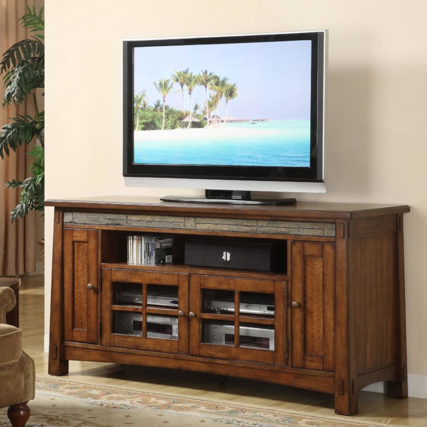 This handsome TV stand echoes the design of the first entry on our list, with a slim accent layer below the top surface and rich natural wood all around. The thick-framed, unfussy design features a pair of glass door cabinets for component access, plus an open shelf for speakers or media. It's an elegant solution enhanced by its balanced Craftsman design. This handsome TV stand echoes the design of the first entry on our list, with a slim accent layer below the top surface and rich natural wood all around. The thick-framed, unfussy design features a pair of glass door cabinets for component access, plus an open shelf for speakers or media. It's an elegant solution enhanced by its balanced Craftsman design.