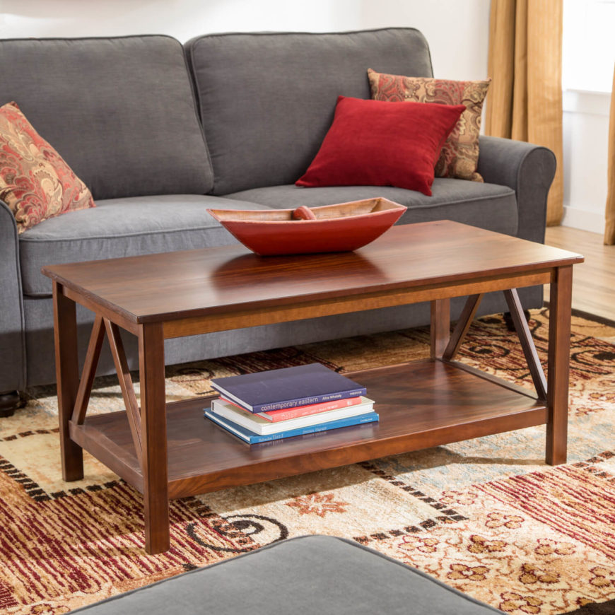 This stylish coffee table is about as far as you could get from the prior model while still remaining a piece of Craftsman home furnishing. Constructed of richly stained wood panels in slimmer pieces, it's a more open, modern looking table with a rather minimalist presence. A triangular design on the sides is all the embellishment it needs. This stylish coffee table is about as far as you could get from the prior model while still remaining a piece of Craftsman home furnishing. Constructed of richly stained wood panels in slimmer pieces, it's a more open, modern looking table with a rather minimalist presence. A triangular design on the sides is all the embellishment it needs.