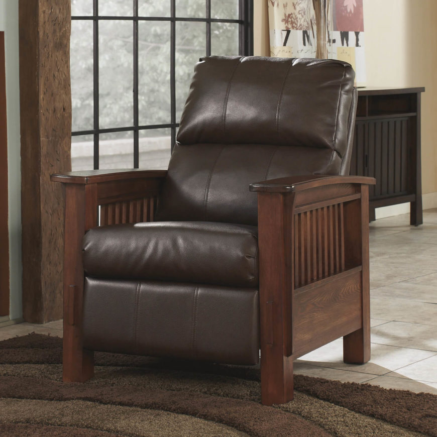 You'll notice that the dark wood framing of this chair features a similar design to the previous chair, arranging a series of vertical slats between thick layers of natural wood. Free of embellishments, the sleek styling complements the rich leather upholstery well. Here, the wood acts as a warm contrast to the dark leather tone. You'll notice that the dark wood framing of this chair features a similar design to the previous chair, arranging a series of vertical slats between thick layers of natural wood. Free of embellishments, the sleek styling complements the rich leather upholstery well. Here, the wood acts as a warm contrast to the dark leather tone.