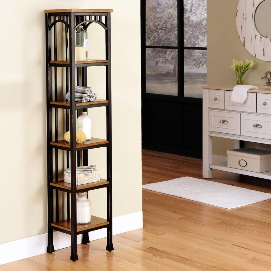 This gorgeous, slim tower features rich oak shelving and a brown powder coated metal frame, perfectly illustrating the simplicity and sturdiness of Craftsman design. The only embellishments are a set of arches beneath the top layer, leaving the stark and strong tower to stand on its own. This gorgeous, slim tower features rich oak shelving and a brown powder coated metal frame, perfectly illustrating the simplicity and sturdiness of Craftsman design. The only embellishments are a set of arches beneath the top layer, leaving the stark and strong tower to stand on its own.