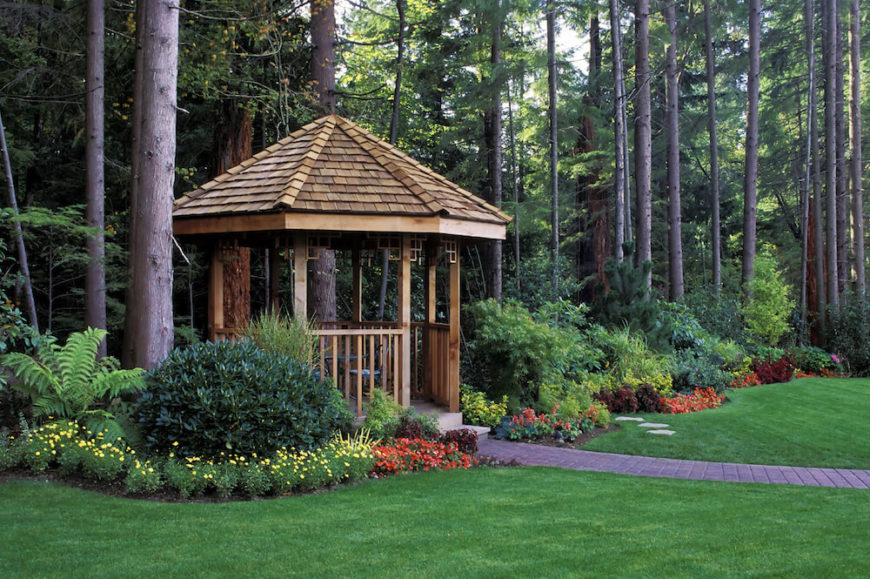 This cedar gazebo is nestled at the edge of the home's property nearest to the forest beyond. A crisp brick walkway leads up to the entrance to the gazebo. This cedar gazebo is nestled at the edge of the home's property nearest to the forest beyond. A crisp brick walkway leads up to the entrance to the gazebo.