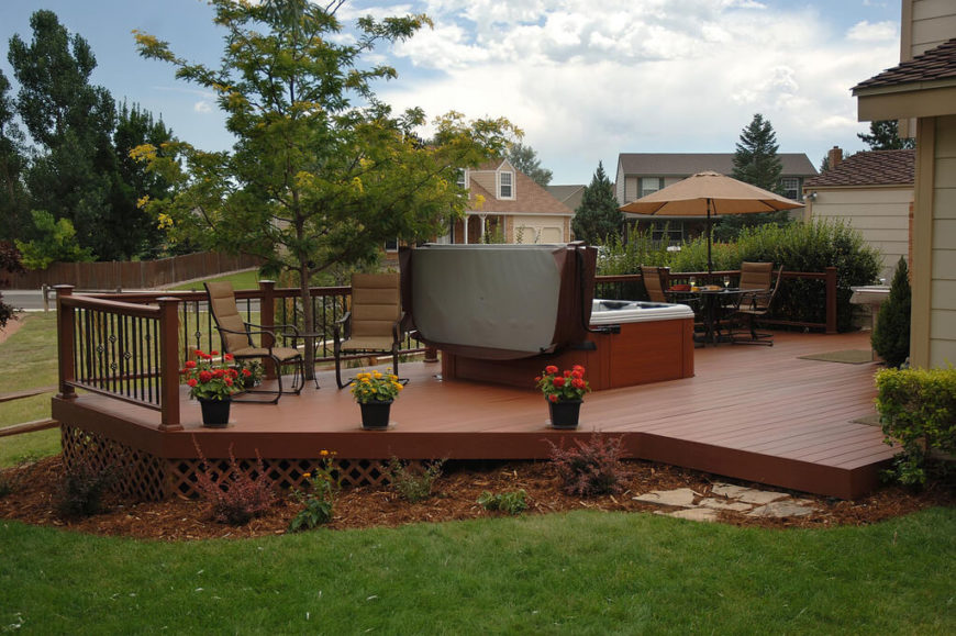 A beautiful wooden deck with a latticed screen around the lower part to keep out rodents and other pests. The deck is in a rich cedar stain and has plenty of space for several seating areas in addition to a hot tub. A beautiful wooden deck with a latticed screen around the lower part to keep out rodents and other pests. The deck is in a rich cedar stain and has plenty of space for several seating areas in addition to a hot tub.