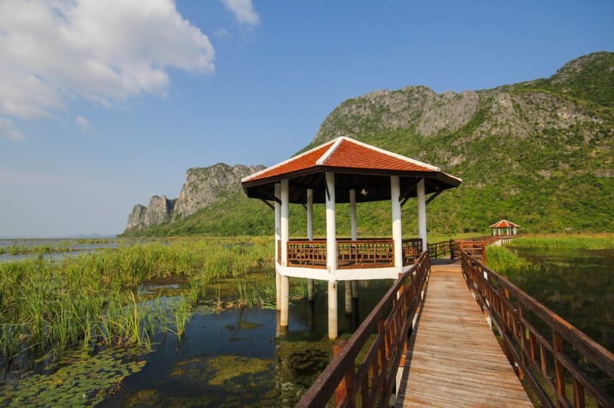 This stilted pavilion rests alongside a bridge across a large marsh and overlooks the beautiful mountainous region on either side of the marsh. This stilted pavilion rests alongside a bridge across a large marsh and overlooks the beautiful mountainous region on either side of the marsh.