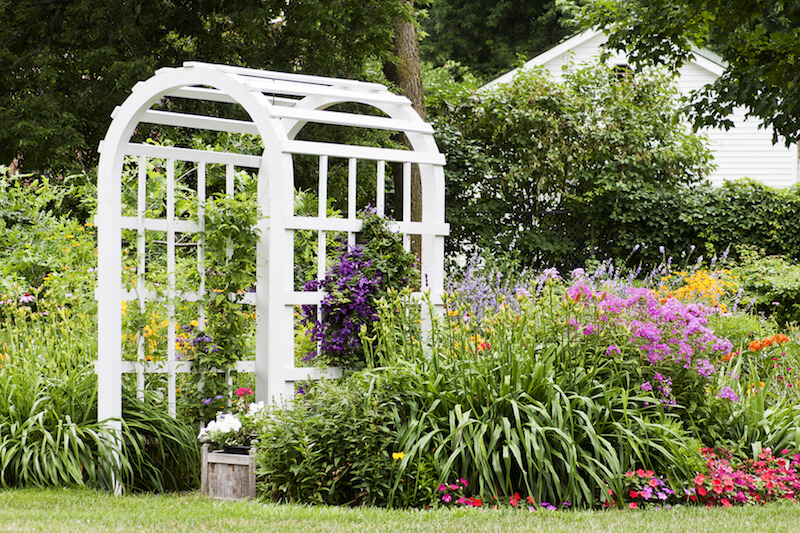 This arbor is a little thicker and has much wider lattices on either side. It's the perfect accompaniment to this thick, colorful garden. This arbor is a little thicker and has much wider lattices on either side. It's the perfect accompaniment to this thick, colorful garden.