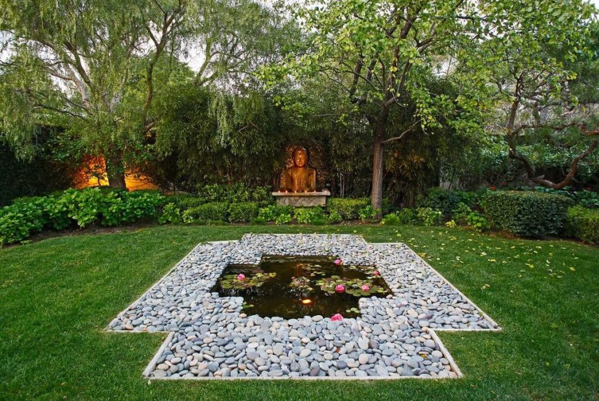 This garden is filled with shrubs and bushes and has a small shrine to one side. At the center is a small pond surrounded by stones. This garden is filled with shrubs and bushes and has a small shrine to one side. At the center is a small pond surrounded by stones.
