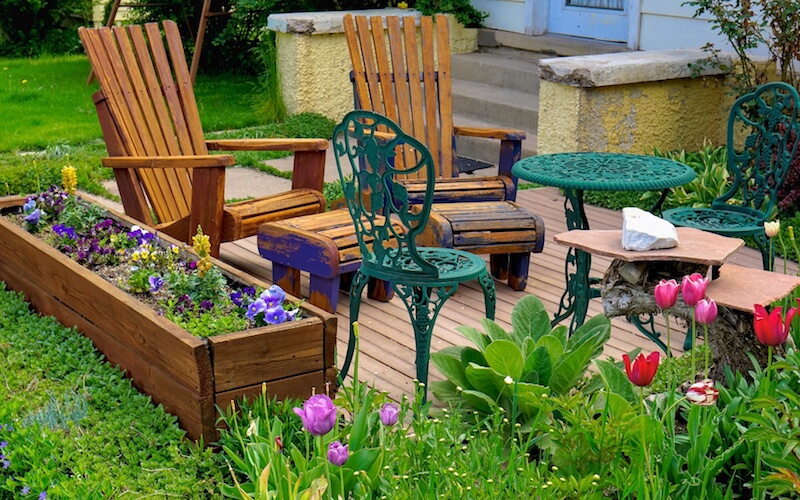This garden is packed around the patio, leaving the rest of the yard for play. This garden is packed around the patio, leaving the rest of the yard for play.