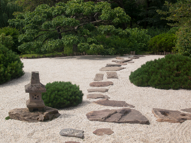 This zen garden focuses namely on sand and stone, but has a few patches of sturdy, thick shrubs. This zen garden focuses namely on sand and stone, but has a few patches of sturdy, thick shrubs.