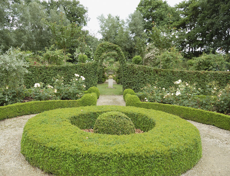 Even hedges can be transformed into topiary art. This garden has arches formed out of the hedge walls. Even hedges can be transformed into topiary art. This garden has arches formed out of the hedge walls.