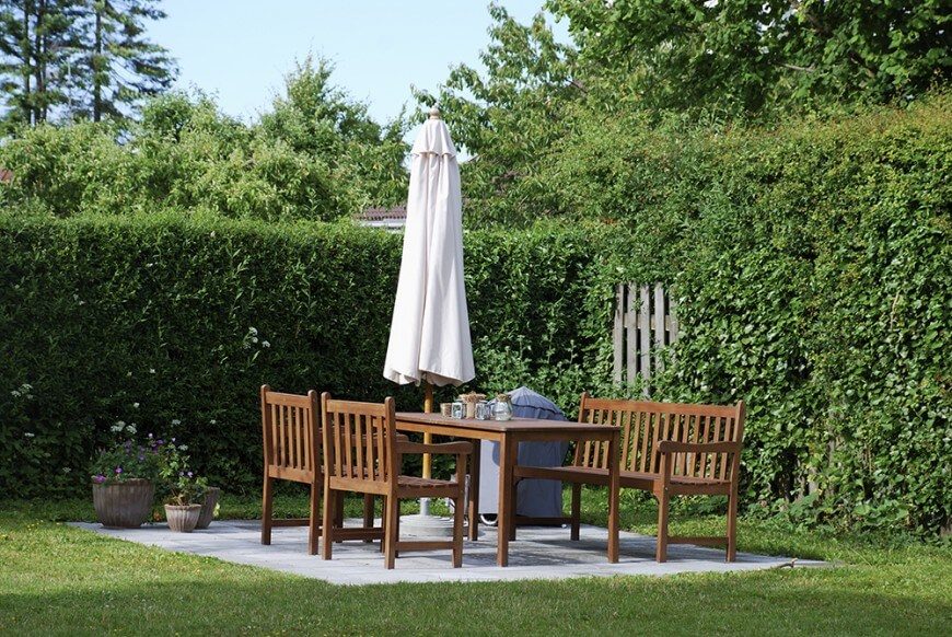 This is a great example of garden hedges used as privacy fences or screens. An old wooden picket fence is hidden inside of these enormous hedges. This is a great example of garden hedges used as privacy fences or screens. An old wooden picket fence is hidden inside of these enormous hedges.