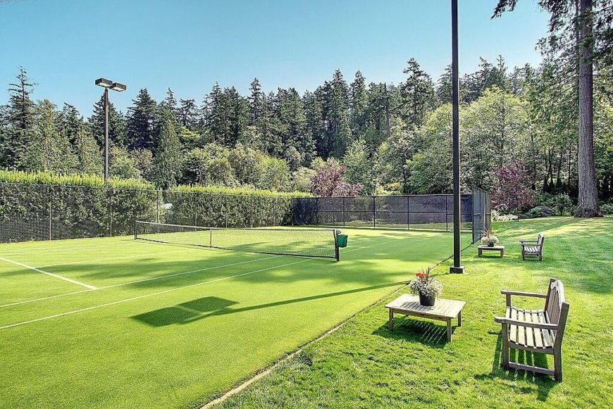This turf tennis court is a little softer than your standard clay court, but it's still a great place to play a match or two This turf tennis court is a little softer than your standard clay court, but it's still a great place to play a match or two