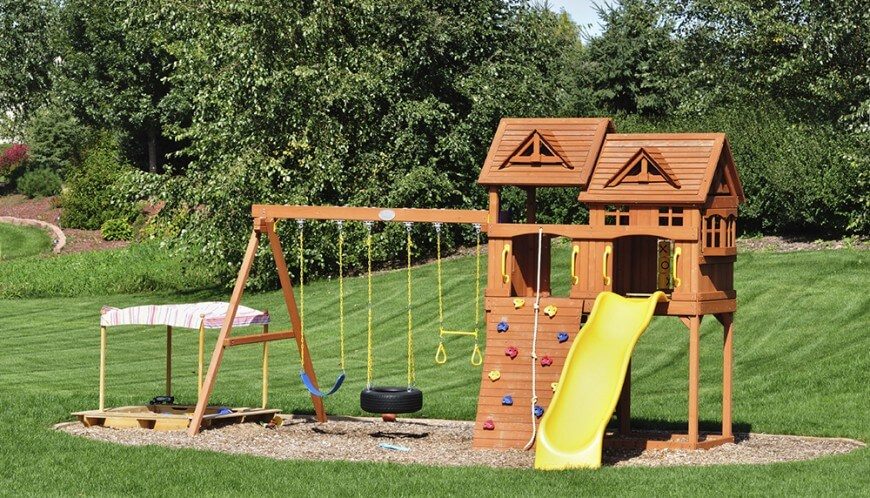 This playground has a little bit of everything, from a rock climbing wall, swings, a tic-tac-toe board, and even a sandbox. This playground has a little bit of everything, from a rock climbing wall, swings, a tic-tac-toe board, and even a sandbox.