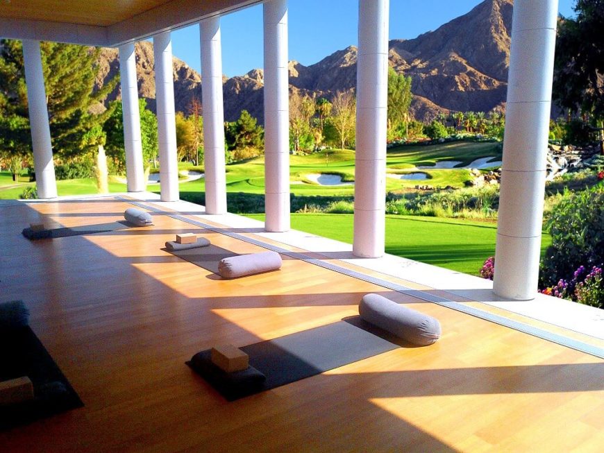 This yoga studio is located on a veranda overlooking a golf course. There's nothing like having the breeze on your skin while moving through yoga poses. This yoga studio is located on a veranda overlooking a golf course. There's nothing like having the breeze on your skin while moving through yoga poses.