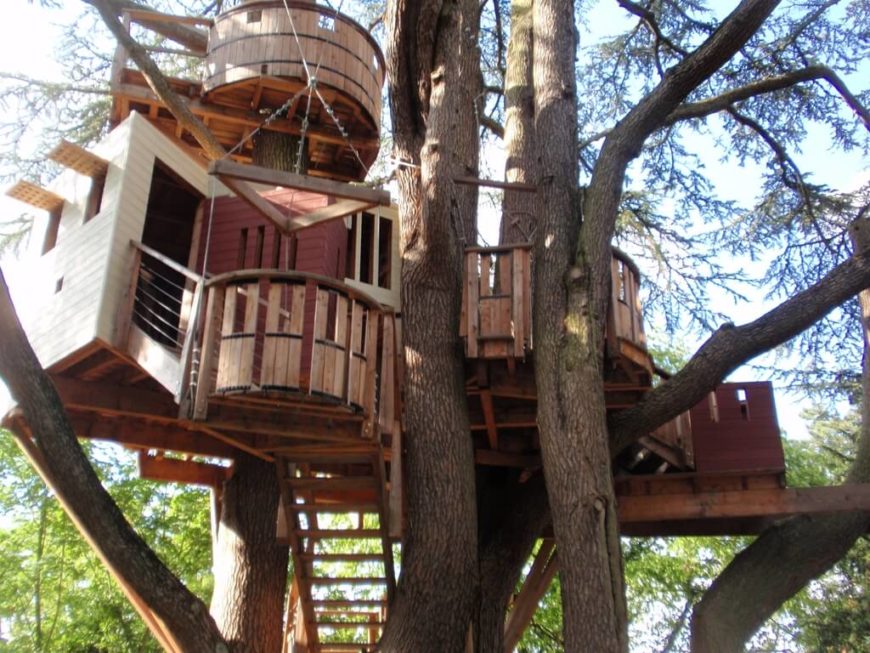 This is a real tree house, with an elevator, shutters, and even a lookout point! This is a real tree house, with an elevator, shutters, and even a lookout point!