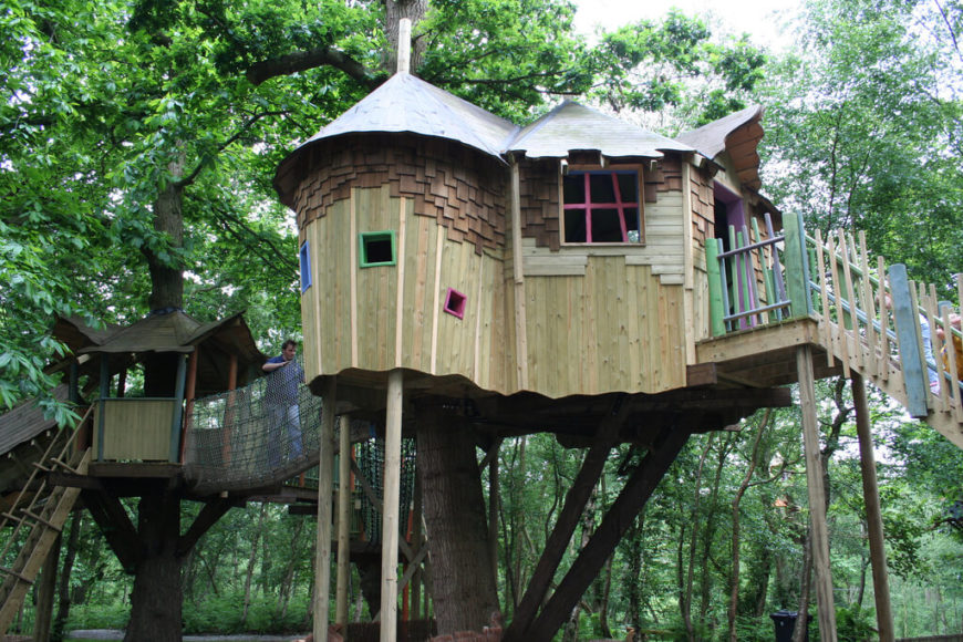 Adding a bit of color and rope bridges to a treehouse really allows the kids to branch out and find new ways to play. Adding a bit of color and rope bridges to a treehouse really allows the kids to branch out and find new ways to play.
