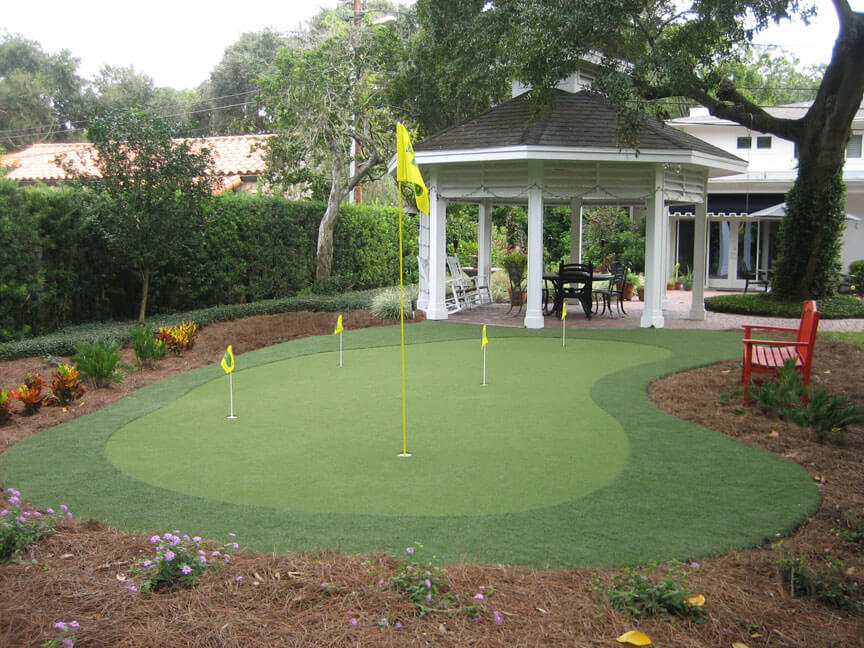 This small putting green is near the gazebo and a brick walkway. This small putting green is near the gazebo and a brick walkway.