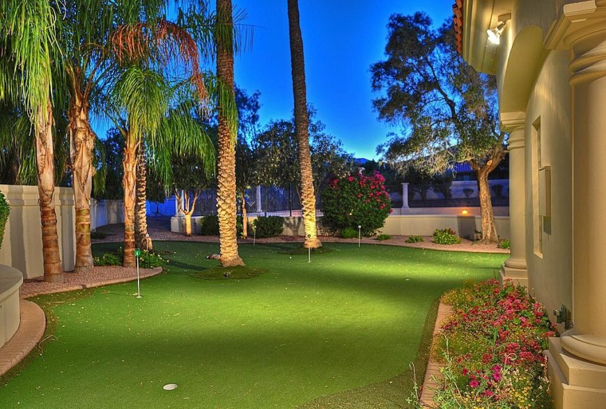 This backyard is almost completely a putting green. Definitely a golfer's dream. This backyard is almost completely a putting green. Definitely a golfer's dream.