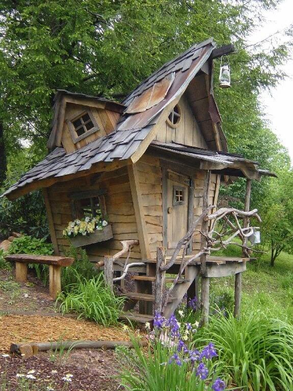 This is a ramshackle play house with crooked windows that give it the look of a fantasy home or maybe a witch's hut. This is a ramshackle play house with crooked windows that give it the look of a fantasy home or maybe a witch's hut.