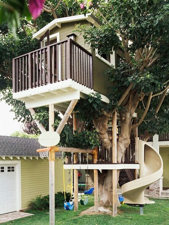 This swing set is attached to a playset and treehouse that's complete with a slide and basketball net. This swing set is attached to a playset and treehouse that's complete with a slide and basketball net.