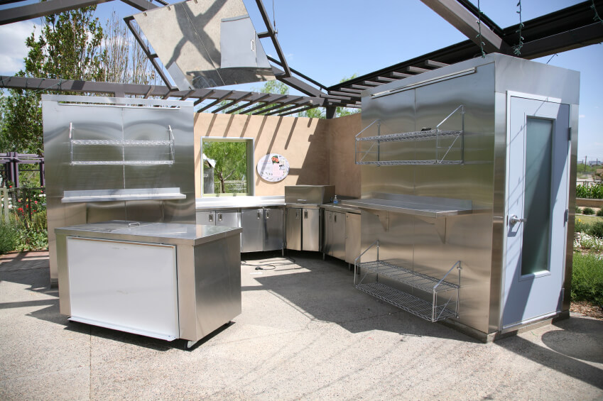 This is a serious outdoor kitchen, complete with stainless steel counters,racks, and a walk-in freezer. This is a serious outdoor kitchen, complete with stainless steel counters,racks, and a walk-in freezer.