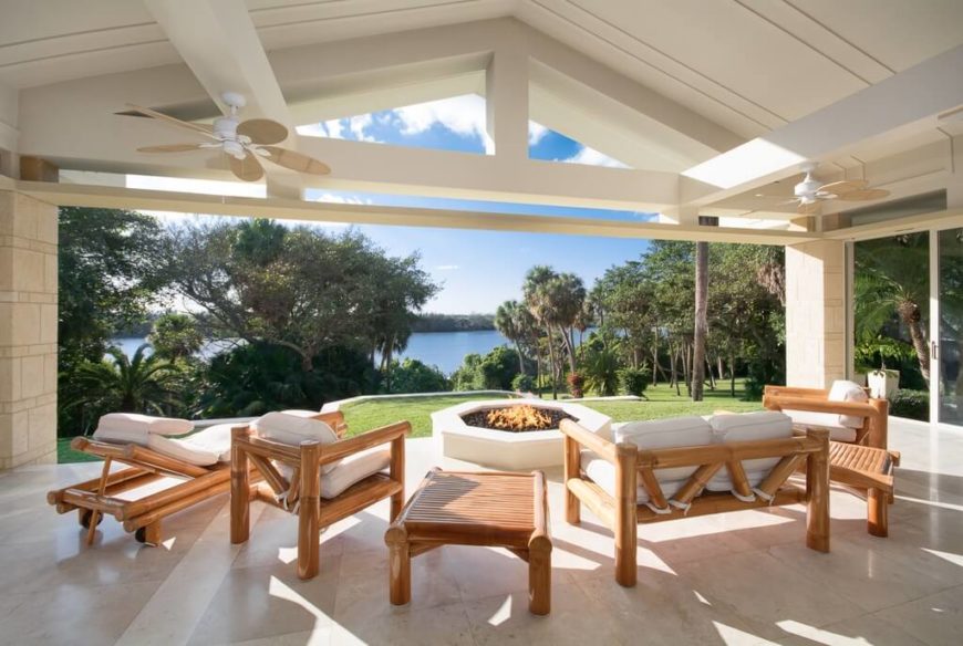This fire pit is located just outside the covered patio, with all the seating protected under the roof. This fire pit is located just outside the covered patio, with all the seating protected under the roof.
