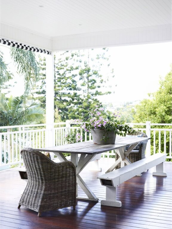 This is a more rustic-chic take on a picnic table, where the benches aren't connected. It looks great on this spacious covered deck. This is a more rustic-chic take on a picnic table, where the benches aren't connected. It looks great on this spacious covered deck.