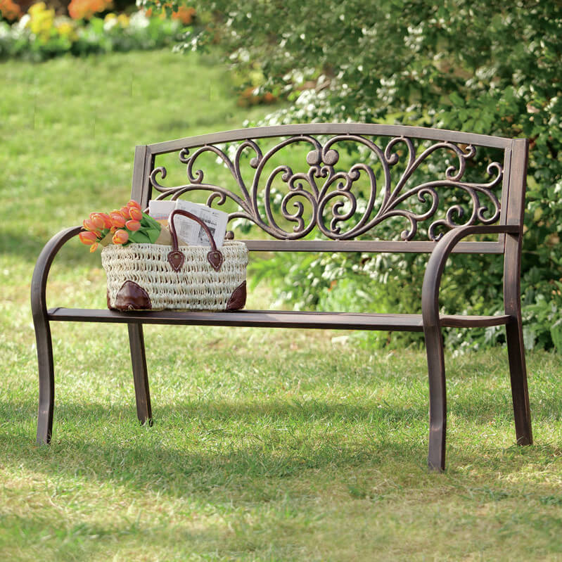An elegant wrought iron bench with scrollwork decorating the backrest. This piece is perfect for any patio area or garden. An elegant wrought iron bench with scrollwork decorating the backrest. This piece is perfect for any patio area or garden.