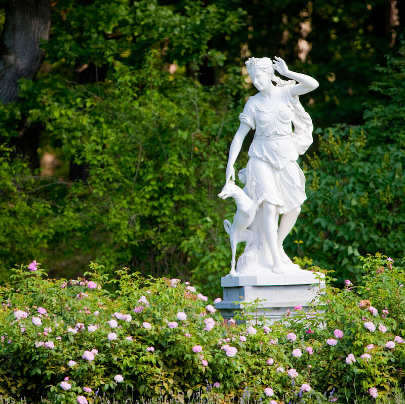If you prefer a more classical design, Greek style statues can make a huge statement in a garden where most plants are much shorter than the statue. If you prefer a more classical design, Greek style statues can make a huge statement in a garden where most plants are much shorter than the statue.