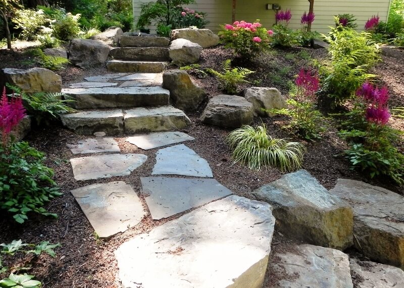 These stone steps are simple, but look very natural against the tropical landscaping. These stone steps are simple, but look very natural against the tropical landscaping.