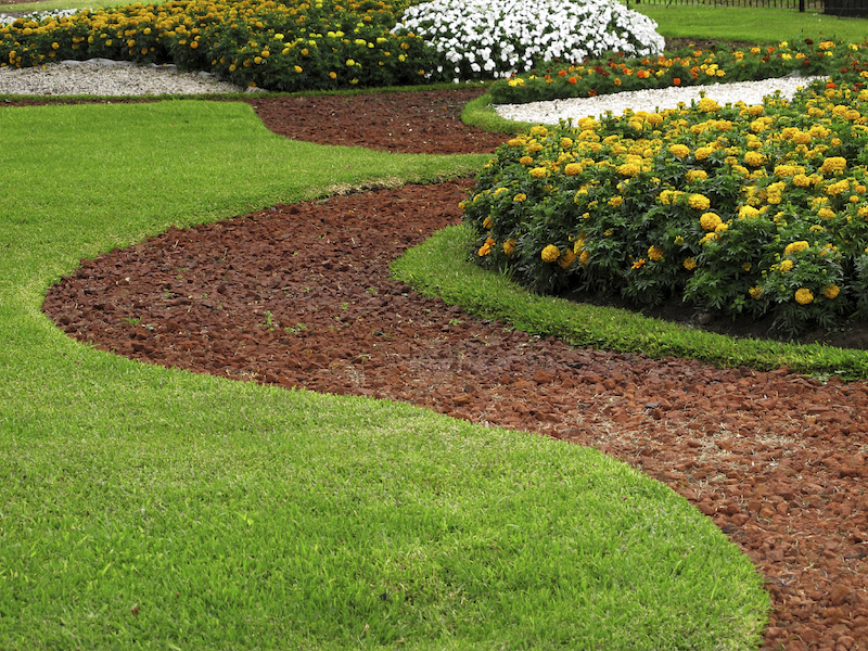 To limit how much grass your lawn has, add large pathways or planting beds. Just be aware that you'll have to mow or weed whack around them. To limit how much grass your lawn has, add large pathways or planting beds. Just be aware that you'll have to mow or weed whack around them.