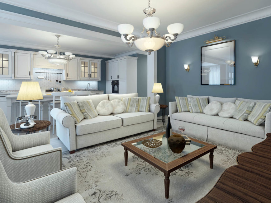 This room has a light and cool color palette, with a few pieces of furniture bringing dark rich wooden tones to contrast. There are hits of green in some of the patterns, but mostly the palette for this room is blue, blue-silver and white. This room has a light and cool color palette, with a few pieces of furniture bringing dark rich wooden tones to contrast. There are hits of green in some of the patterns, but mostly the palette for this room is blue, blue-silver and white.