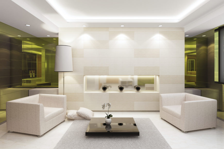 This living room consists of mostly white, with a splash of black for some contrast. The green tinted mirrors bring some interesting color to an otherwise simple design. This living room consists of mostly white, with a splash of black for some contrast. The green tinted mirrors bring some interesting color to an otherwise simple design.